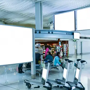 Freestanding digital signage displays in a public space, ideal for budget-friendly advertising and wayfinding in Atlanta venues